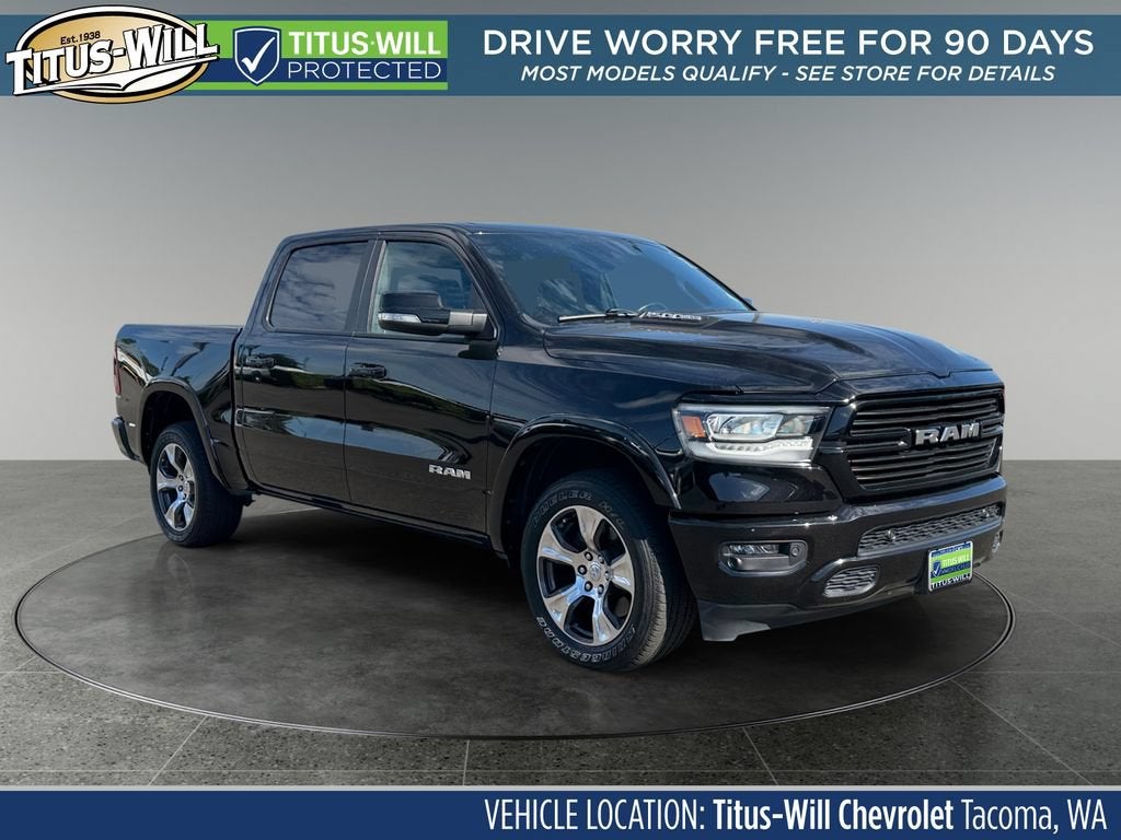 2022 RAM 1500 Laramie Crew Cab 4x4 5'7" Box in Black — front three-quarter view
