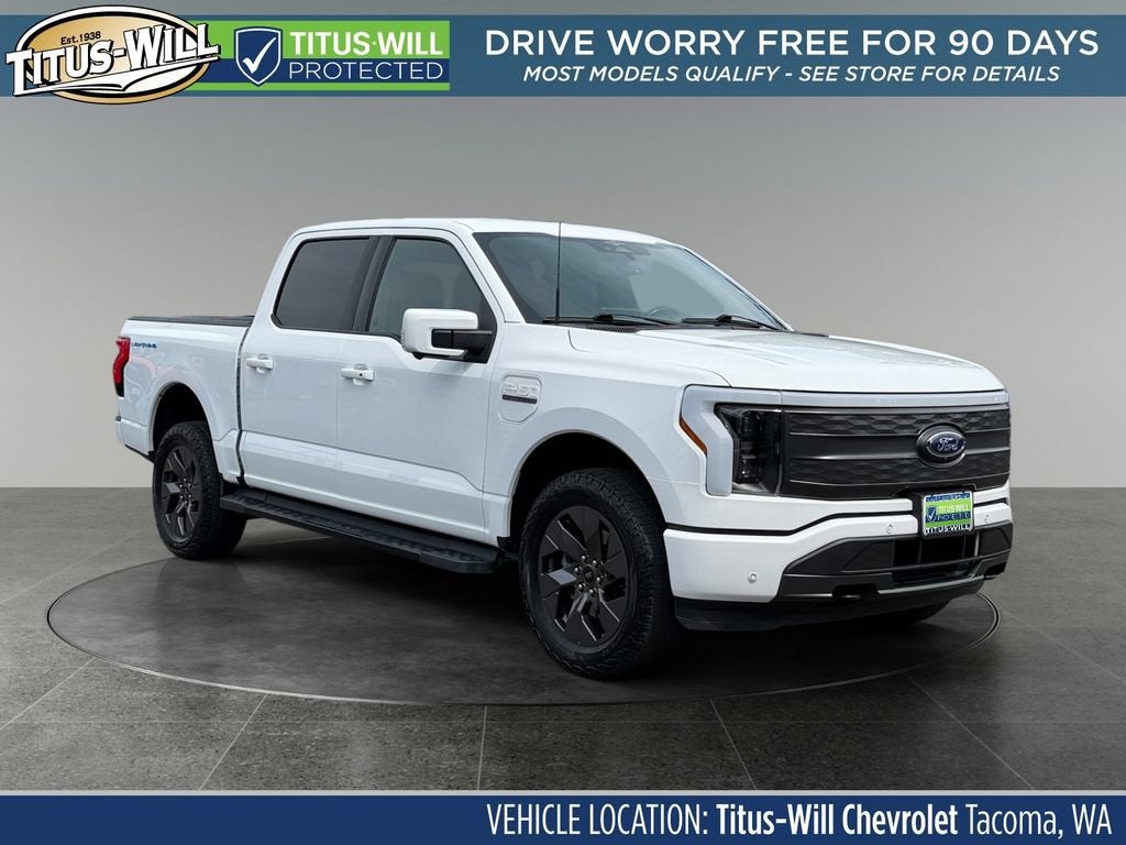 2023 Ford F-150 Lightning LARIAT in White — front three-quarter view