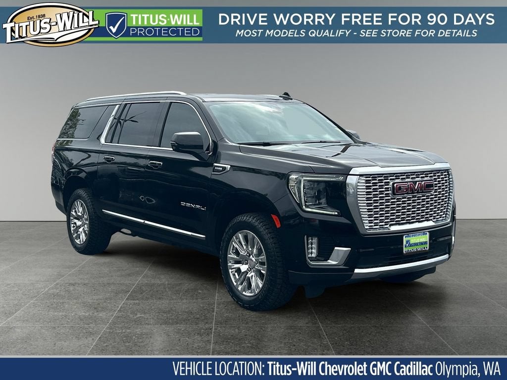 2024 GMC Yukon XL Denali in Onyx Black — front three-quarter view