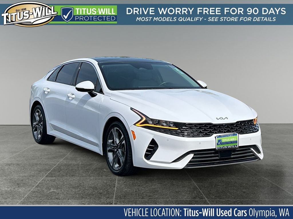2024 Kia K5 EX in Glacial White Pearl — front three-quarter view