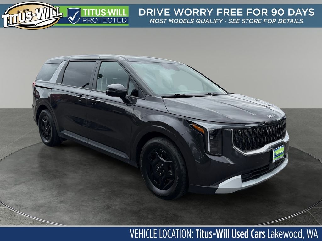 2026 Kia Carnival LXS in Panthera Metal — front three-quarter view