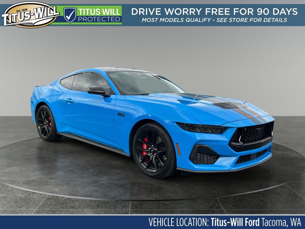 2025 Ford Mustang GT in Grabber Blue Metallic — front three-quarter view